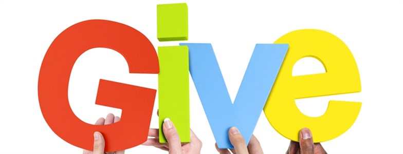 charitable giving strategies hands holding letters that spell give